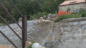 A stone wall with a metal staircase and a spherical object on top. - house / villa - Monacia d'Aullène (Monacia-D'aullène)