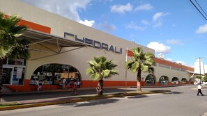 A building with the sign 'FLEDRAU' and a covered entrance. - Location, location, location, private villa, pool, Vonage, Wifi, close to town (Cozumel,Q Roo)