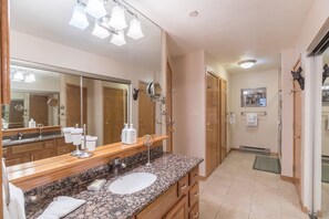Combined shower/bathtub, hair dryer, towels, soap