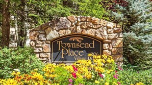 A stone archway with a sign reading "Townsend Place 1906 Village Road." - 3/2 Ski In/Out  BEAVER CREEK, steps to Village, Townsend Place A307 (Beaver Creek)