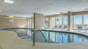 Relax by the rectangular pool surrounded by a tiled deck.