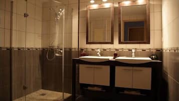 Shower, hair dryer, towels, toilet paper