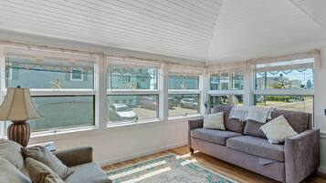 Flat-screen TV, DVD player, books, video library