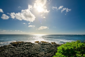 On the beach, sun loungers, beach towels - Best Oceanfront  - Walls of windows on famous surf and sunset,  2BR/2BA, A/C (Koloa)