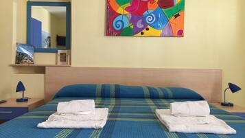 1 bedroom, desk, iron/ironing board, travel crib