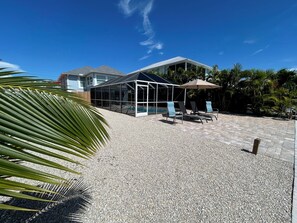 Outdoor pool, a heated pool - 140 Primo Dr Waterfront House, Htd Pool, Dock, Walk To Times Square 2 Bed 2 Bath (Fort Myers Beach)