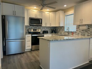 Fridge, microwave, oven, stovetop - 140 Primo Dr Waterfront House, Htd Pool, Dock, Walk To Times Square 2 Bed 2 Bath (Fort Myers Beach)