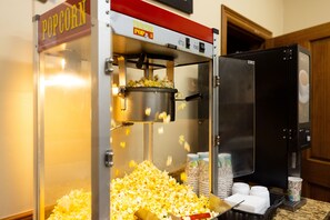 Enjoy freshly popped popcorn from our in-room theater machine.