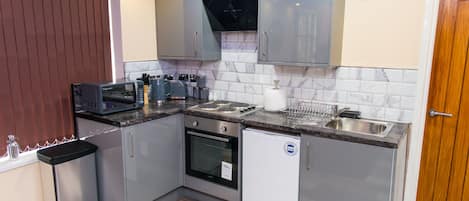 Apartamento ejecutivo, baño privado | Cocina privada