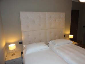 Premium bedding, blackout drapes, free WiFi, bed sheets