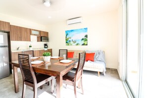 Apartment | Living area | Flat-screen TV - The Furlough Fur101 (Playa del Carmen)