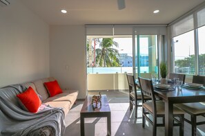 Apartment | Living area | Flat-screen TV - The Furlough Fur204 (Playa del Carmen)