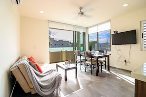 Apartment | Living area | Flat-screen TV - The Furlough Fur204 (Playa del Carmen)