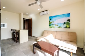 Apartment | Living area | Flat-screen TV - The Furlough Fur302 (Playa del Carmen)