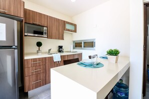 Apartment | Private kitchen | Full-sized fridge, microwave, stovetop, coffee/tea maker - The Furlough Fur302 (Playa del Carmen)