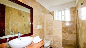 A bathroom with a sink, toilet, and shower. - Apartment Castello 1B (Playa del Carmen)