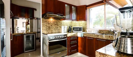 Villa | Private kitchen | Full-sized fridge, microwave, coffee/tea maker, toaster