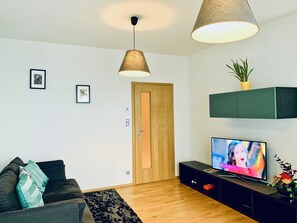 Apartamento com design assinado, 2 quartos, acessível, vista para a cidade | TV