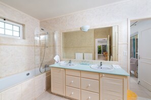 Shower, hair dryer, towels, toilet paper