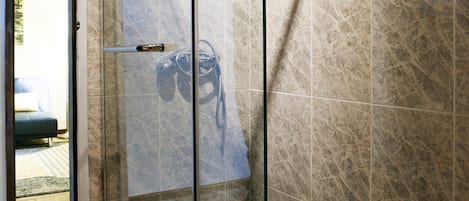 Shower, hair dryer, towels, soap
