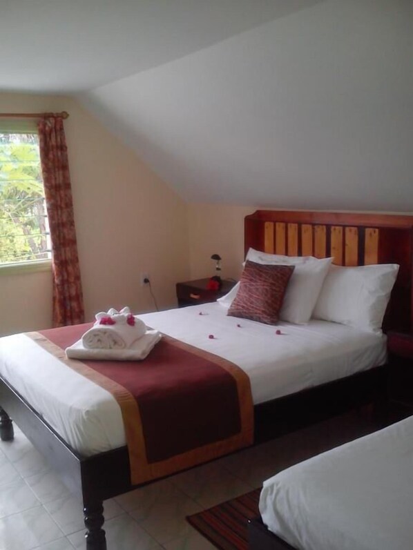 Queen Room, with AirCond, Shared Bathroom  | Blackout drapes, iron/ironing board, WiFi, bed sheets