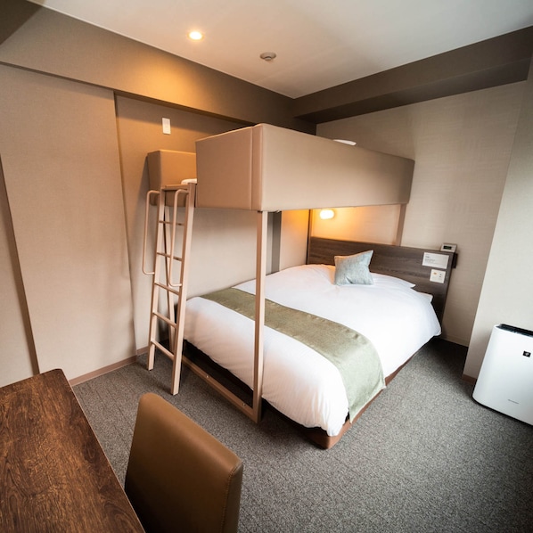 A bunk bed room with a ladder, a desk, and a nightstand. - SUPERHOTEL Premier GINZA (Tokyo)