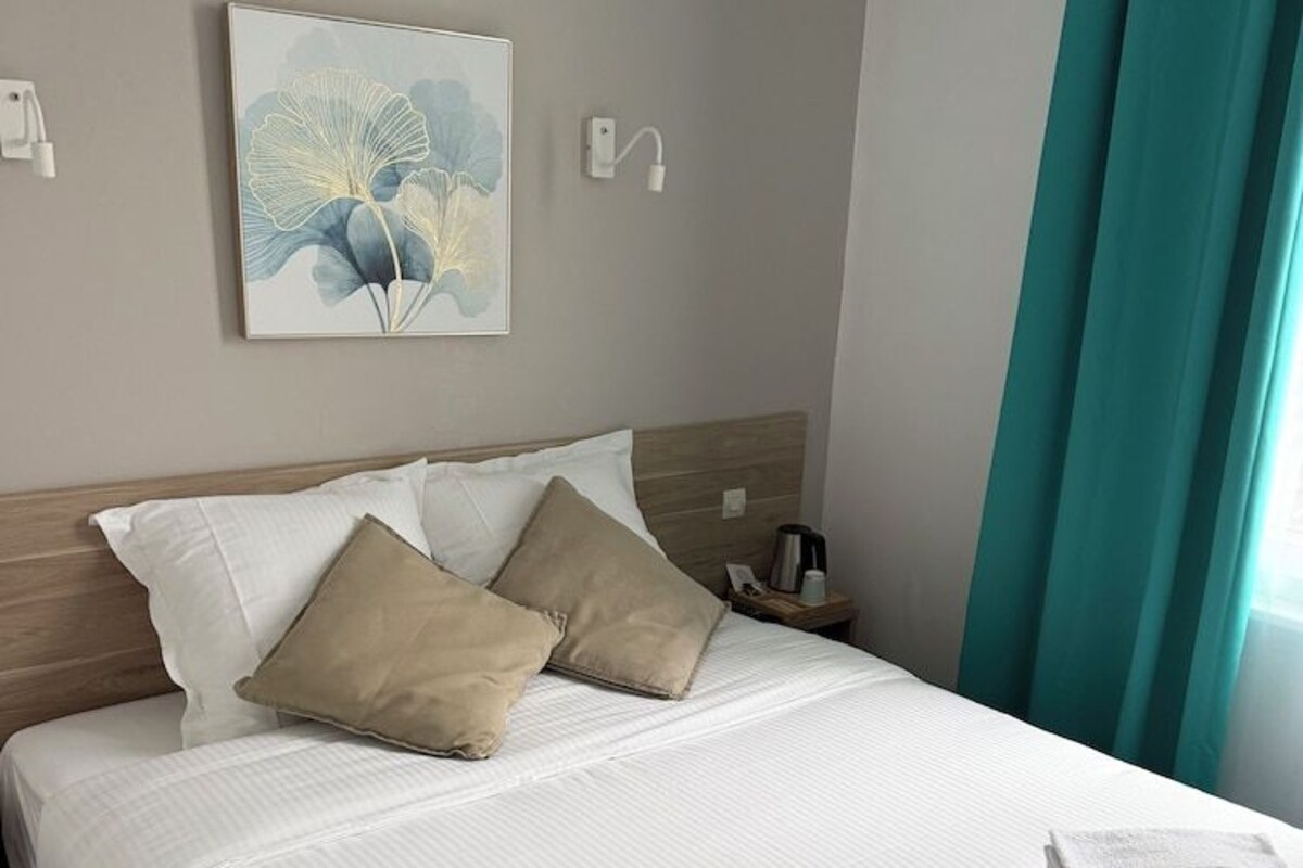 Premium bedding, desk, laptop workspace, iron/ironing board (on request)
