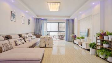 Peach Blossom Apartment, 3 Bedrooms | Living room | TV