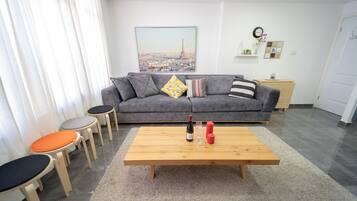 Classic apartment, 1 bedroom | Living area | Flat-screen TV