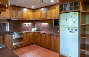 Villa | Private kitchen | Full-size fridge, microwave, stovetop, electric kettle