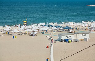 Private beach nearby, 5 beach bars