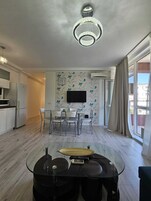 Deluxe Apartment, Non Smoking, Balcony | Living area | 42-inch flat-screen TV with cable channels, TV