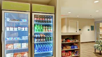 Two refrigerated display cases labeled 'frozen' and 'cold' with various food and beverage items.