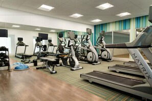 A gym with treadmills, elliptical machines, and weight equipment. - Holiday Inn Express Alliance by IHG (Alliance)