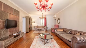 Luxury Apartment | Living area | Flat-screen TV