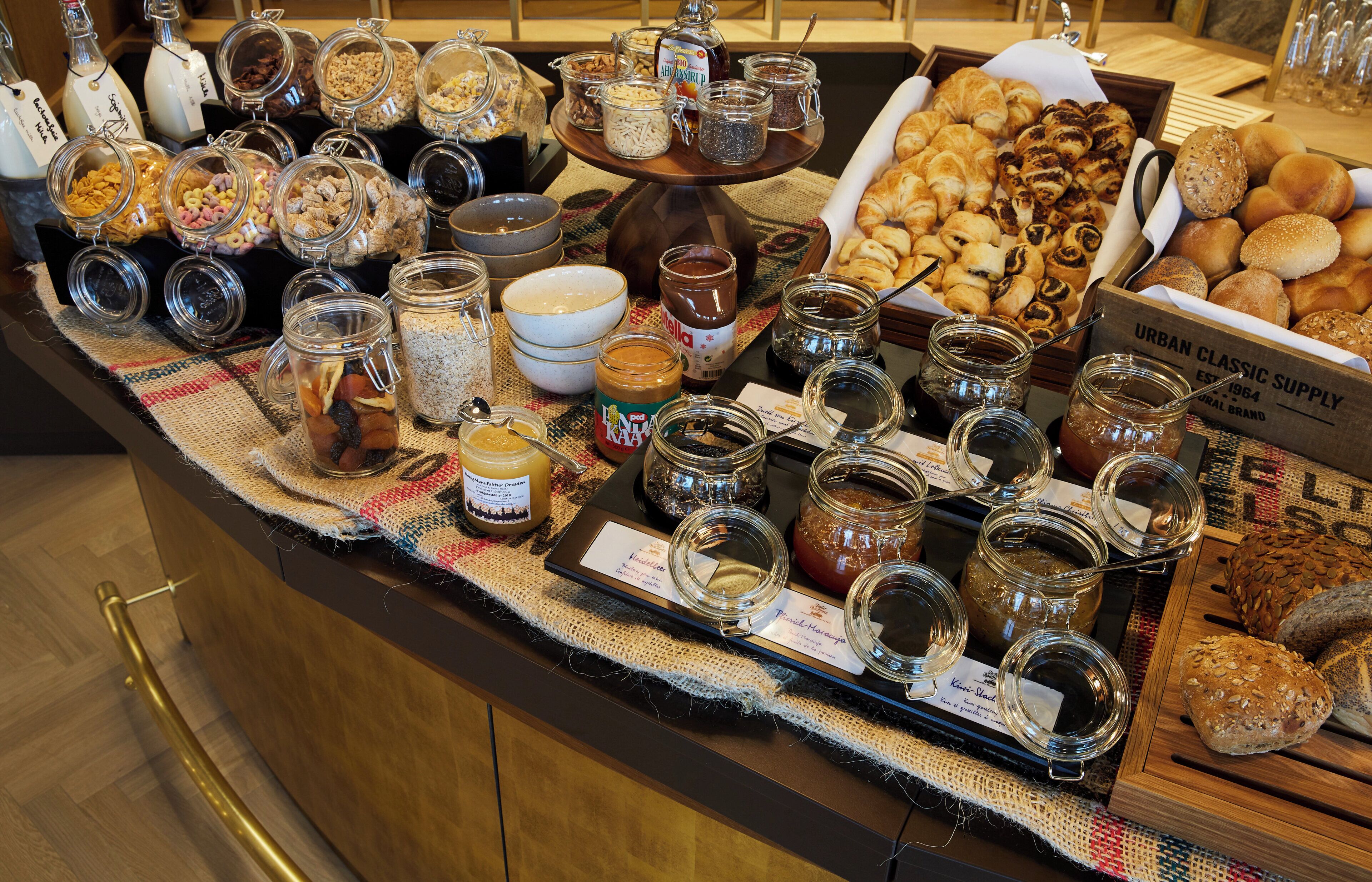 A buffet spread with various food items and condiments.