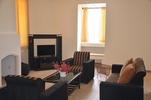 Standaard kamer | Woonkamer | Flatscreentelevisie