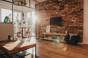 Departamento, 1 habitación | Área de sala de estar | Televisión de pantalla plana