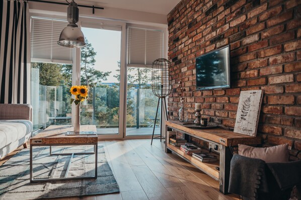 Suite estudio | Área de sala de estar | Televisión de pantalla plana