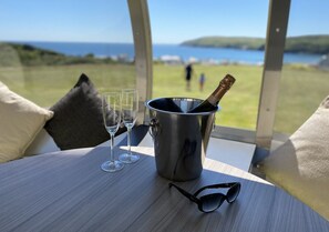 Relax in a serene space with expansive views of the surrounding landscape and a tranquil atmosphere.