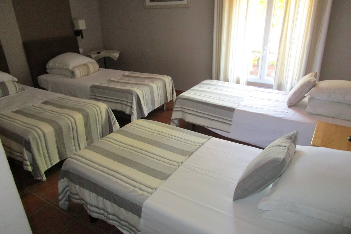 Quadruple Room | Desk, blackout curtains, iron/ironing board (on request), free WiFi