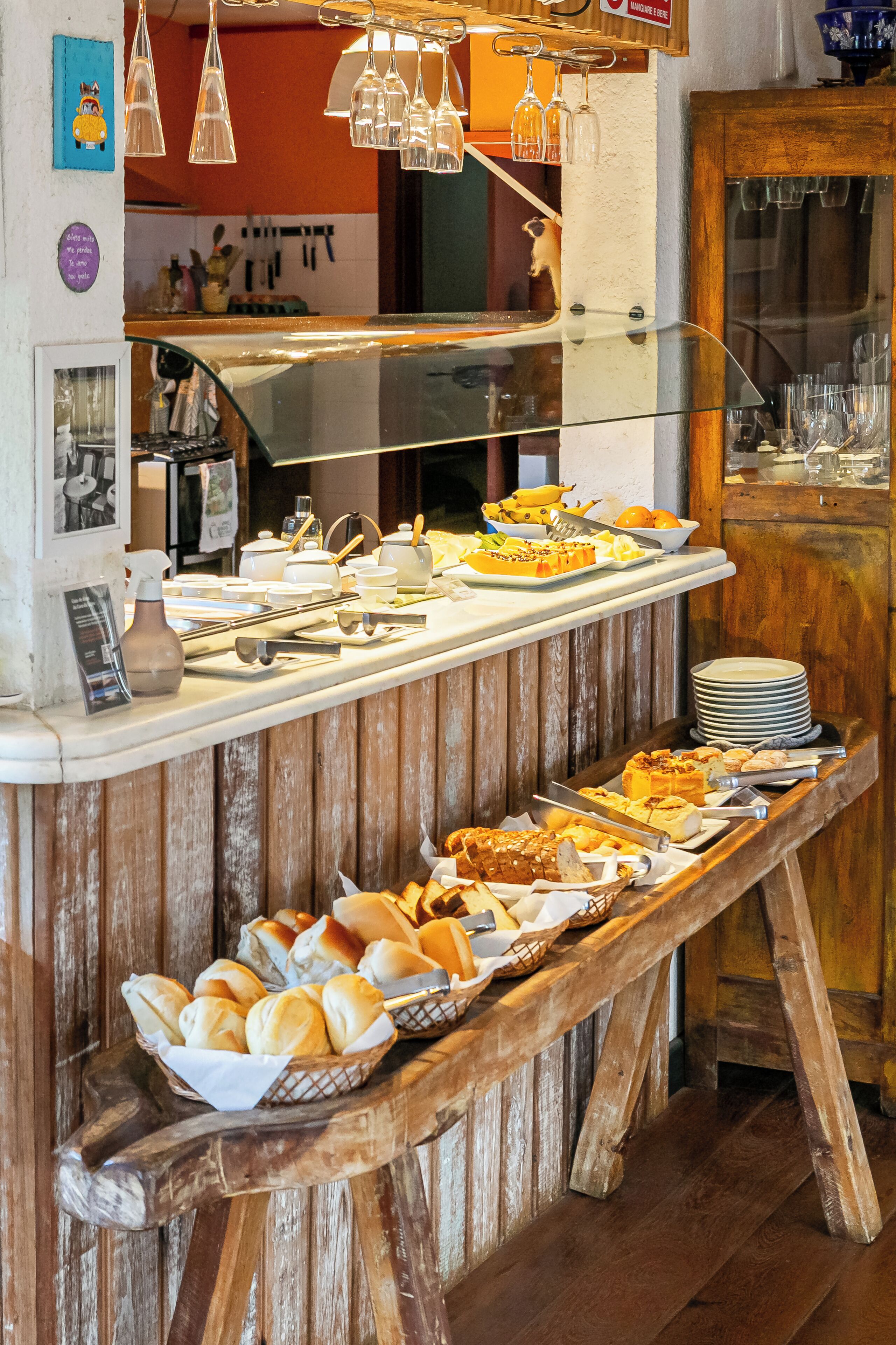 A buffet setup with various food items and utensils.