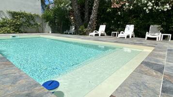 Seasonal outdoor pool, open 10:00 AM to 8:00 PM, sun loungers