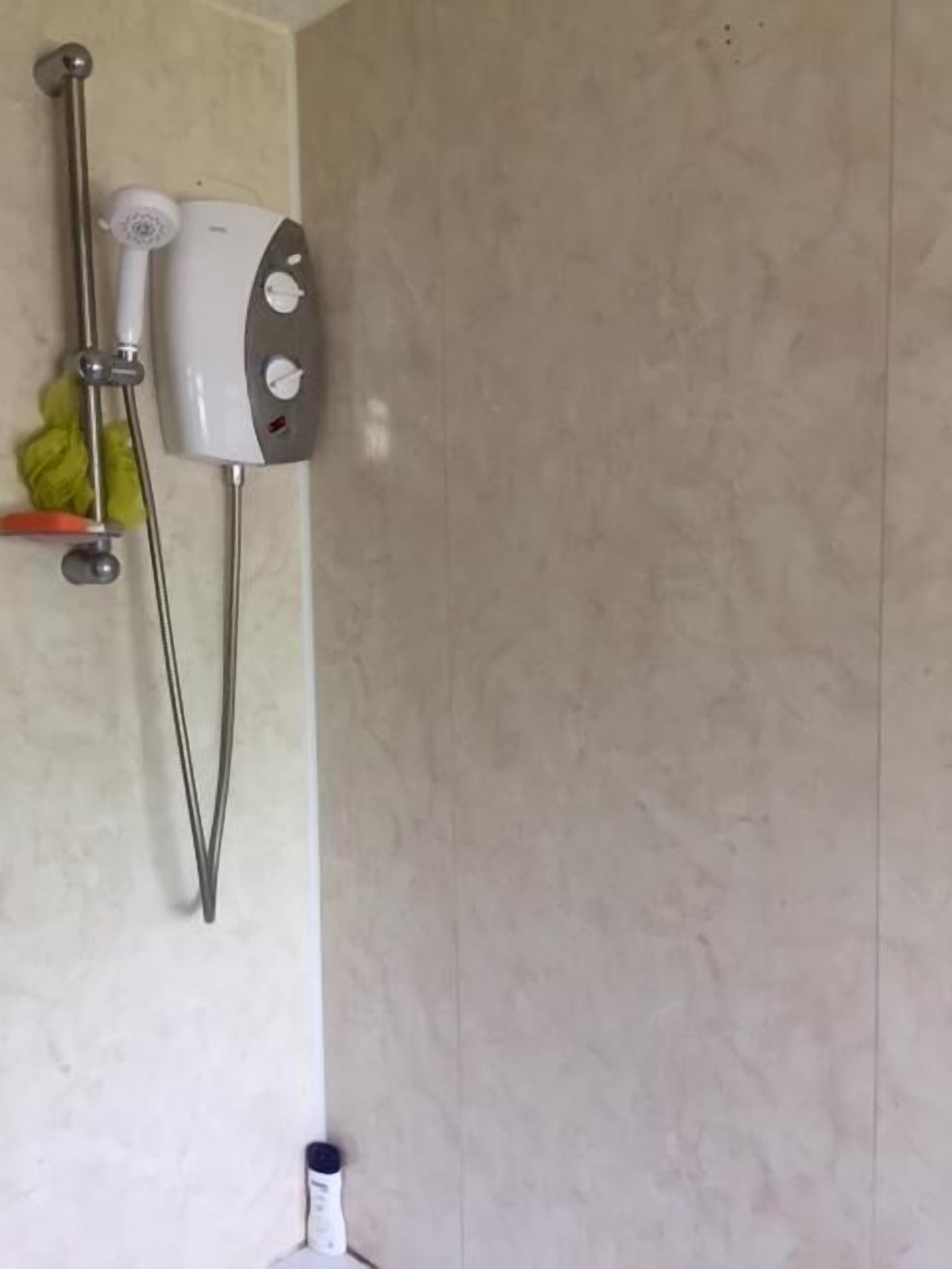 Shower, hair dryer, slippers, towels