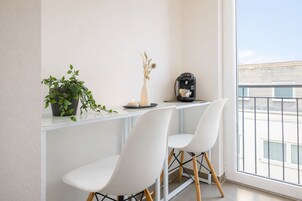 Comfort Studio Apartment with balcony | Living area | 43-inch flat-screen TV with satellite channels, TV, offices