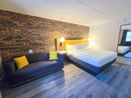 Suite, King Bed w/ Sofabed | Premium bedding, down comforters, blackout drapes, free WiFi