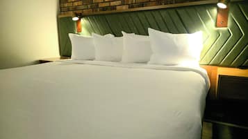 Suite, King Bed w/ Sofabed | 1 bedroom, blackout drapes, free WiFi, bed sheets