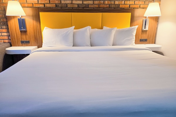 Suite, King Bed w/ Sofabed | Premium bedding, down comforters, blackout drapes, free WiFi