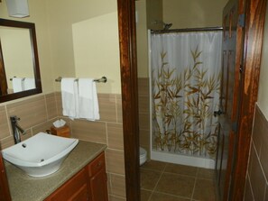 Quadruple Room, Multiple Beds, Private Bathroom | Bathroom | Shower, rainfall showerhead, free toiletries, hair dryer