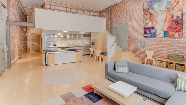 A spacious loft apartment with a kitchen, dining area, and living room. - Spacious Luxury Historic Loft in Downtown SF (San Francisco)